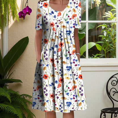 LINA™ | Stilren sommarklänning med blommigt mönster och fickor